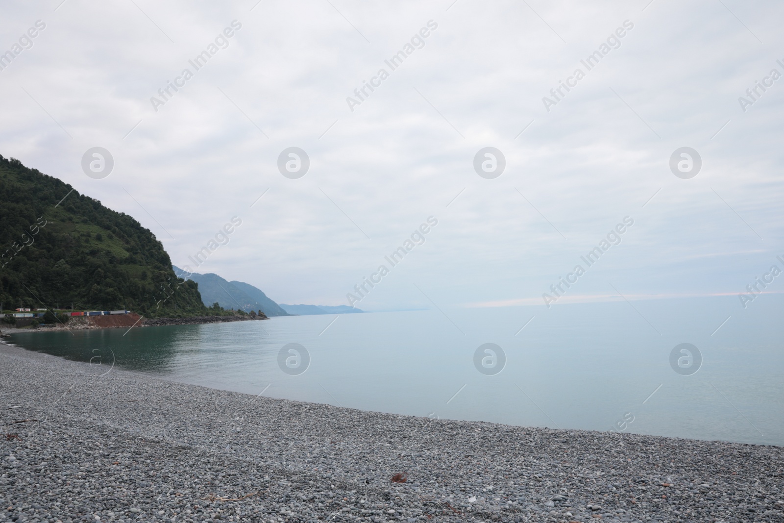 Photo of Picturesque view of sea coast and pebble beach. Space for text