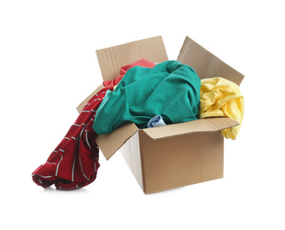 Cardboard box with clothes isolated on white