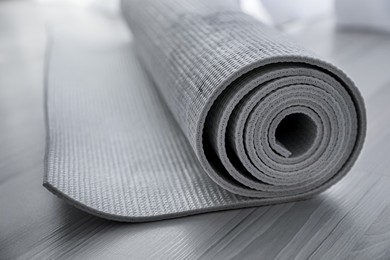 Photo of Karemat or fitness mat on floor, closeup