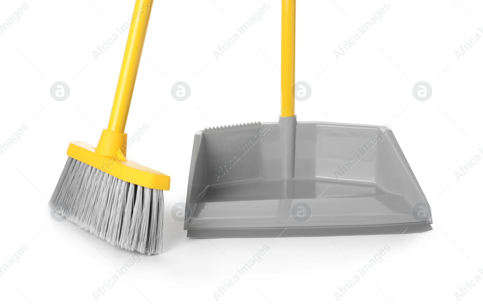 Photo of Plastic broom and dustpan on white background