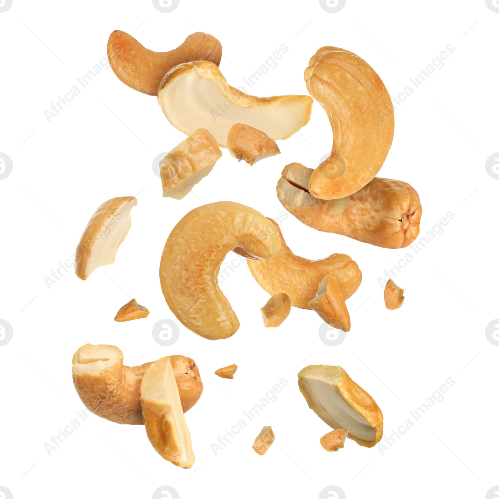 Image of Tasty cashew nuts flying on white background