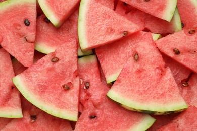 Photo of Slices of tasty ripe watermelon as background, top view