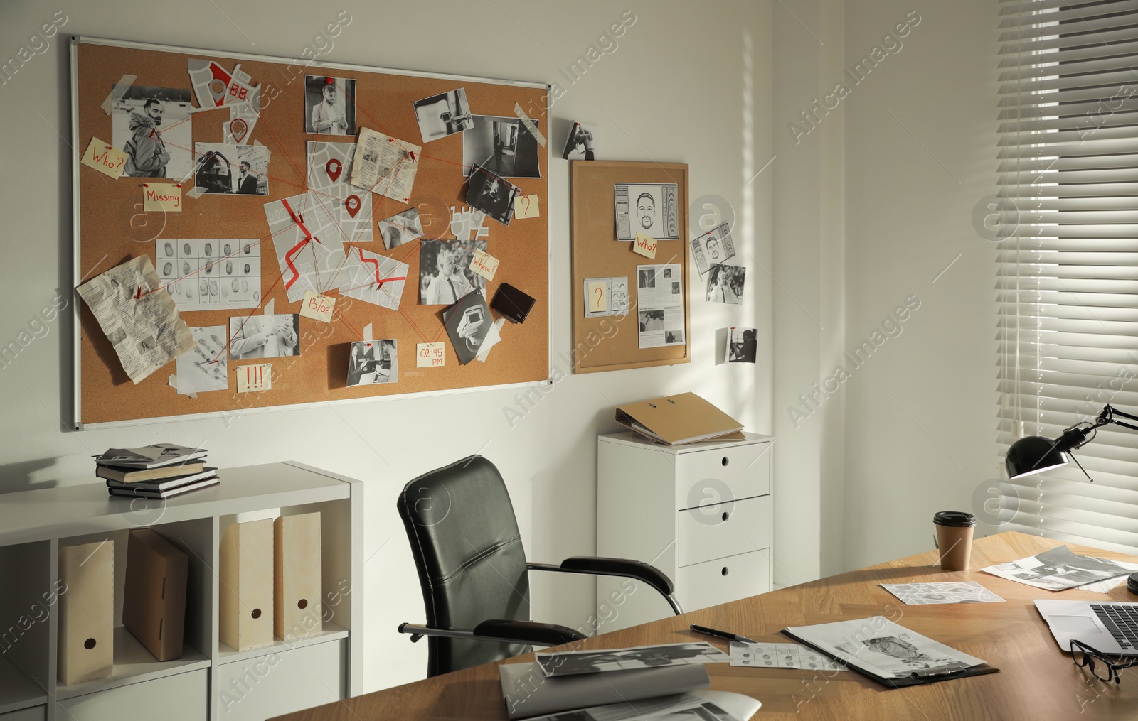 Photo of Detective office interior with big wooden desk and evidence board