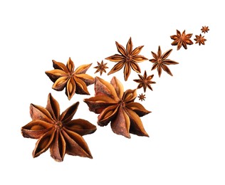 Image of Dry aromatic anise stars falling on white background