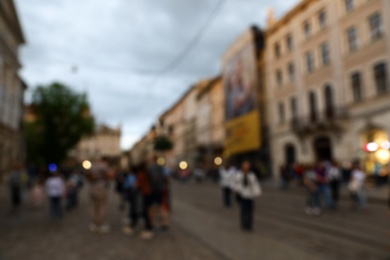 LVIV, UKRAINE - APRIL 27, 2019: People walking Market Square, blurred view