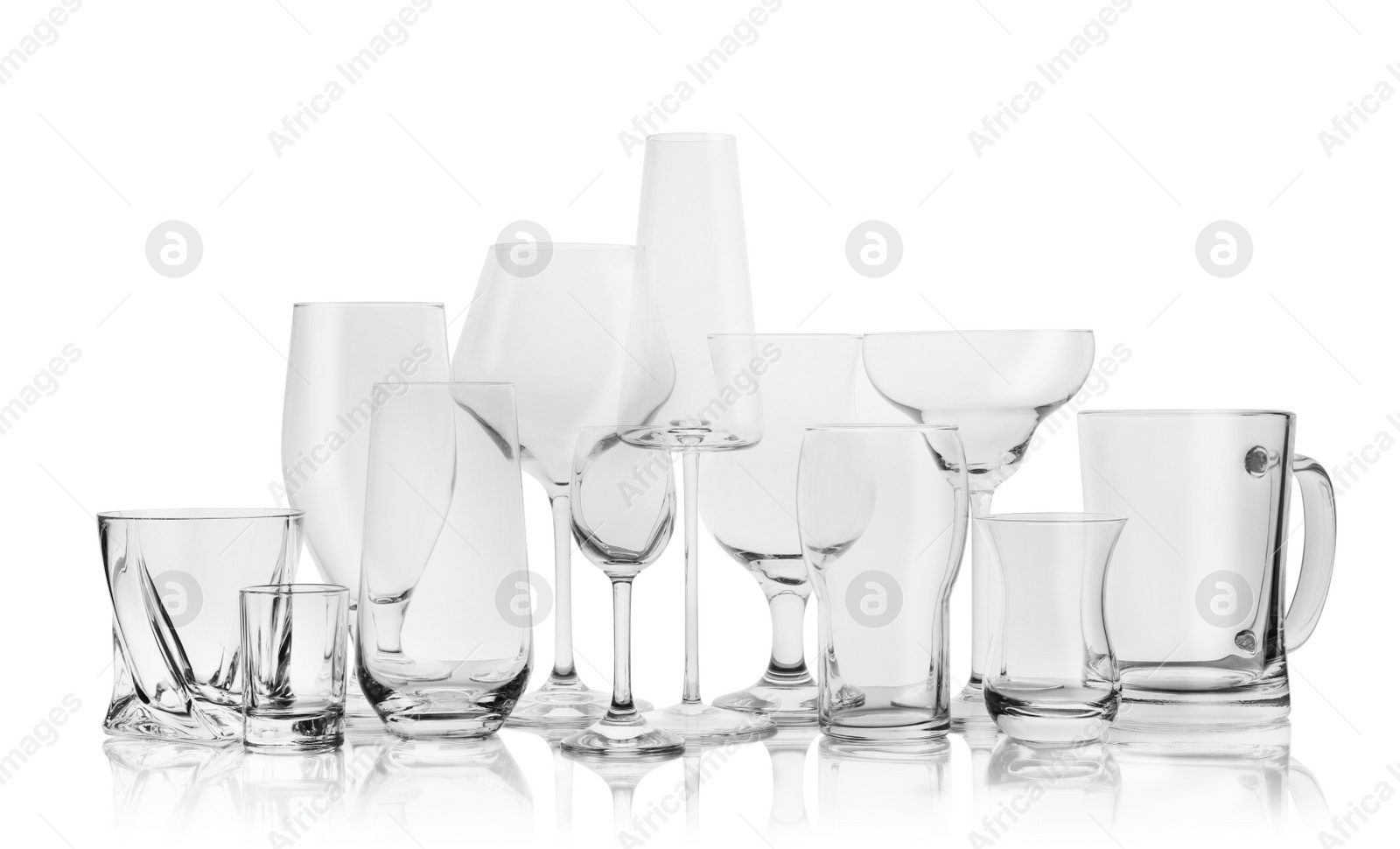 Photo of Set of empty glasses for different drinks on white background