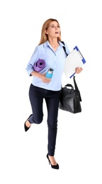 Photo of Businesswoman with sport stuff, briefcase and clipboard running on white background. Combining life and work