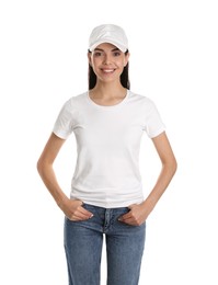 Photo of Young happy woman in cap and tshirt on white background. Mockup for design