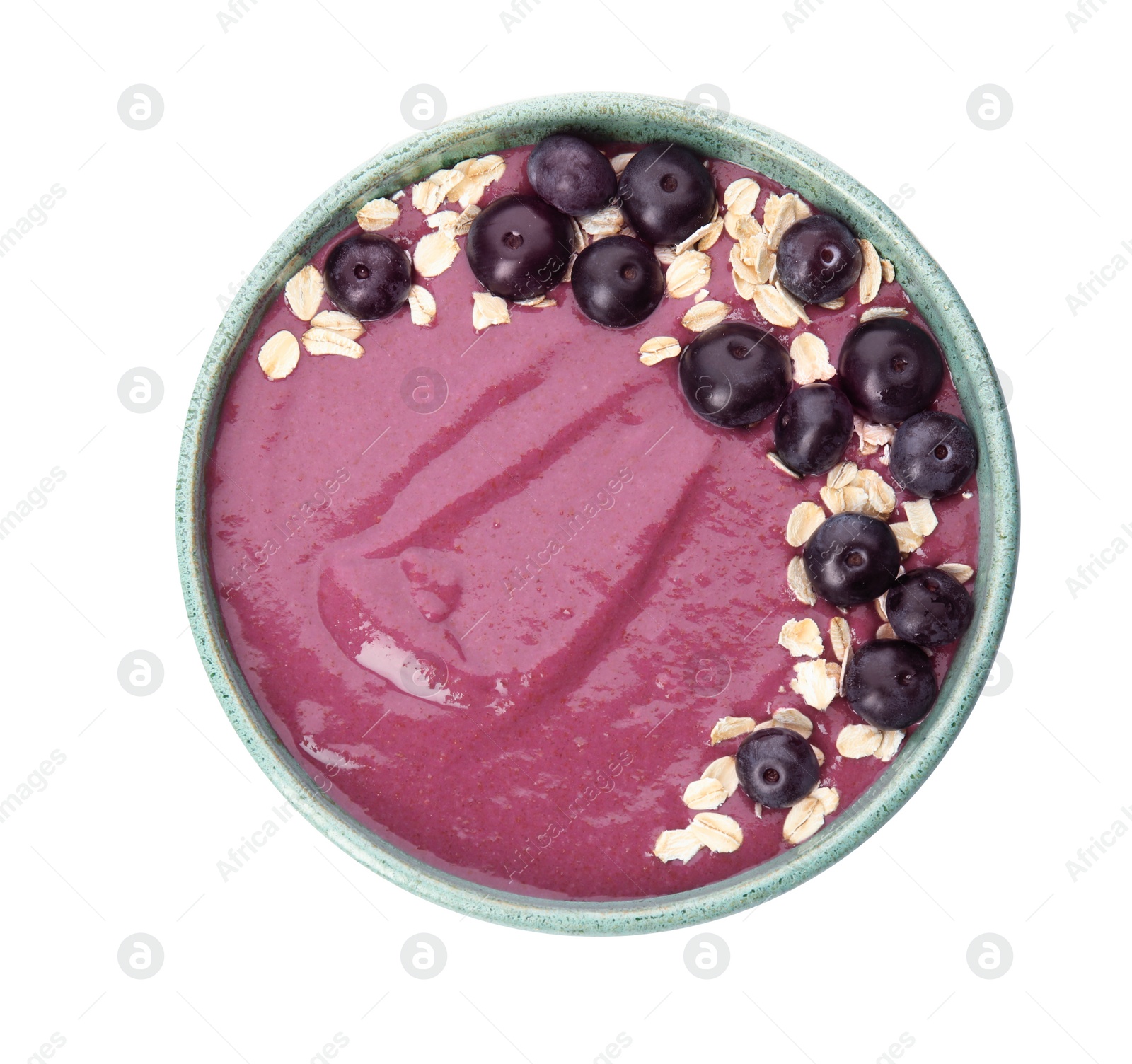 Photo of Bowl with tasty acai smoothie on white background, top view