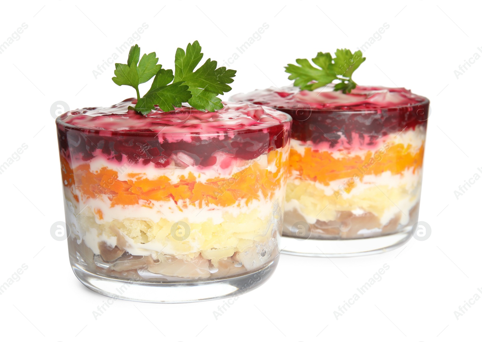 Photo of Herring under fur coat isolated on white. Traditional russian salad