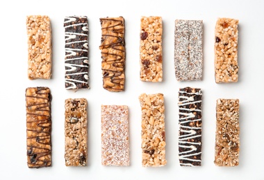 Different grain cereal bars on white background. Healthy snack