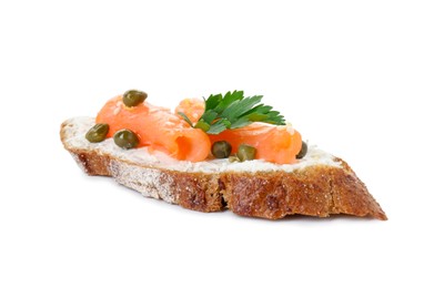 Photo of Tasty canape with salmon, capers and cream cheese isolated on white