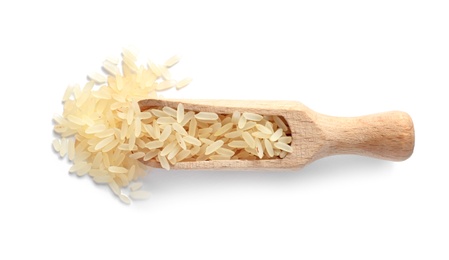 Photo of Scoop with uncooked parboiled rice on white background, top view