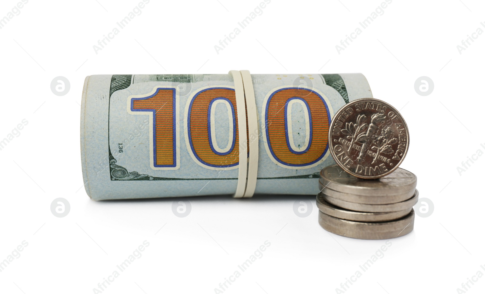 Photo of Rolled dollar banknotes and stack of coins on white background