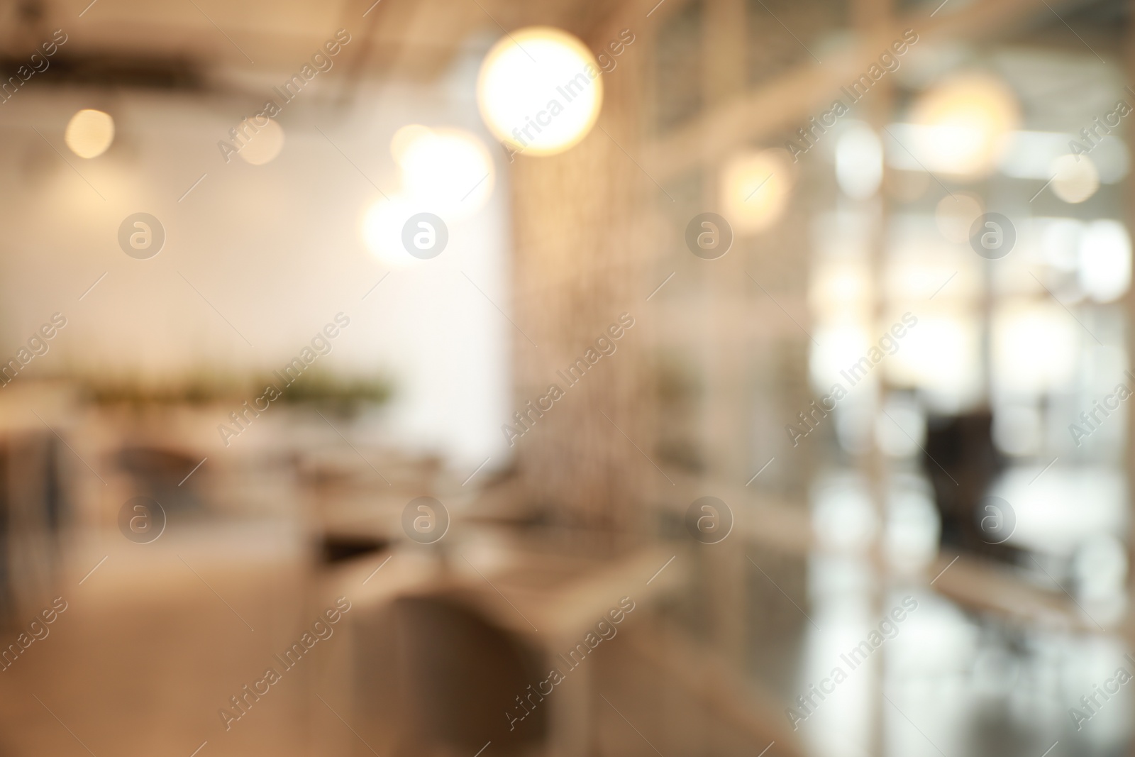 Photo of Blurred view of beautiful modern cafe interior