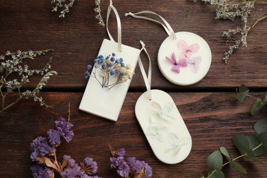 Flat lay composition with scented sachets on wooden table
