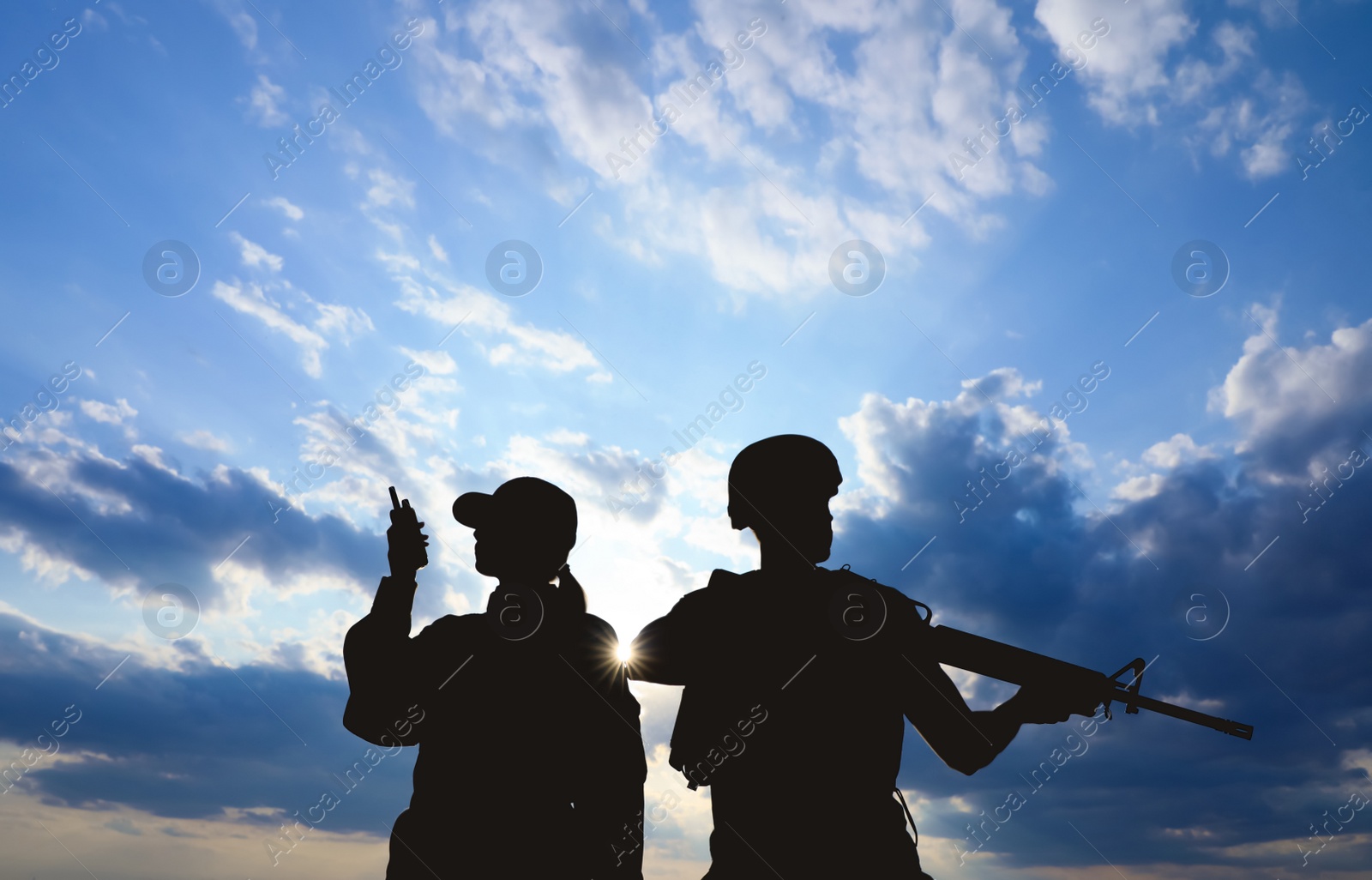 Photo of Soldiers in uniform patrolling outdoors. Military service