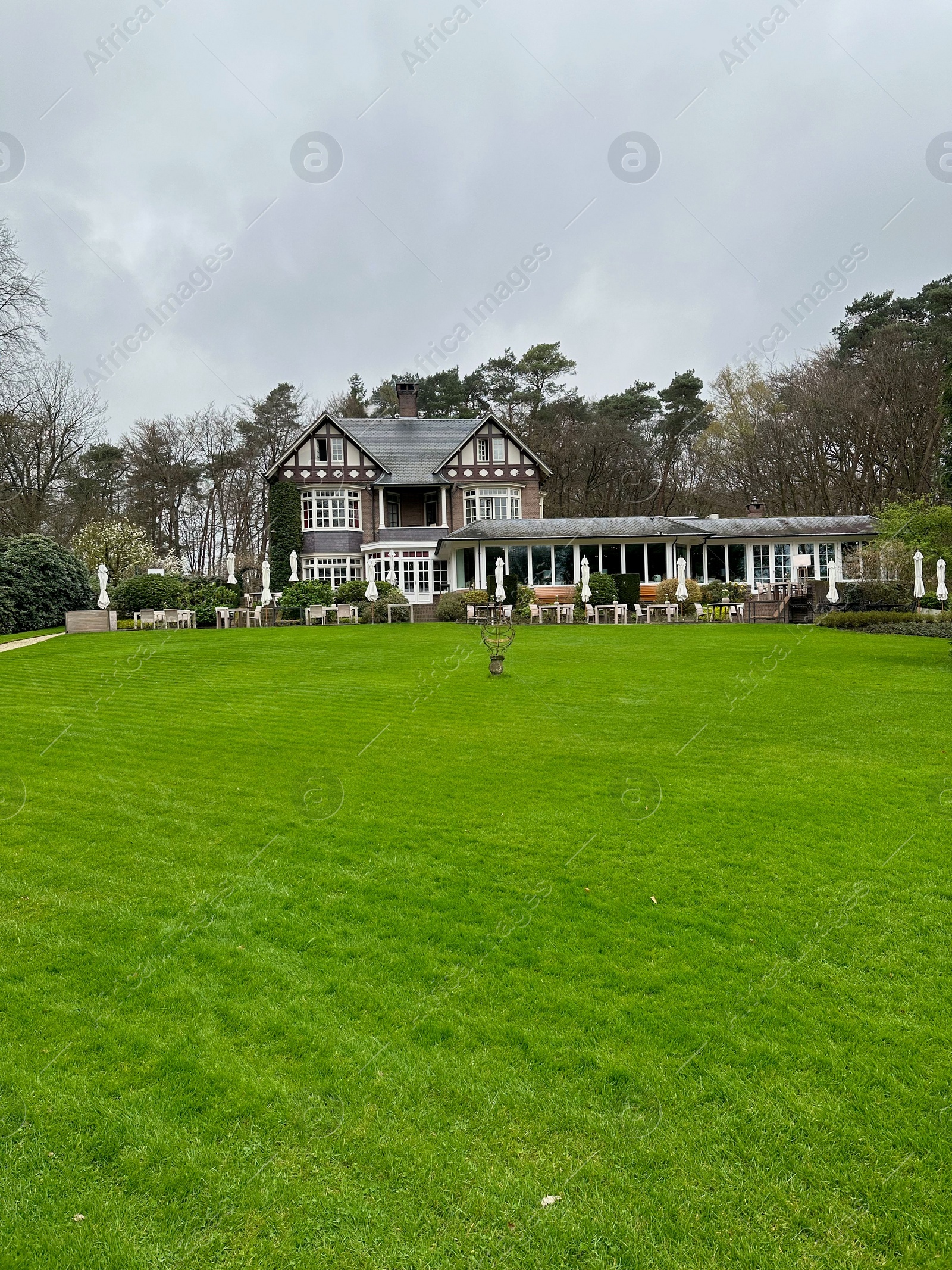 Photo of Luxury hotel, garden and green trees outdoors
