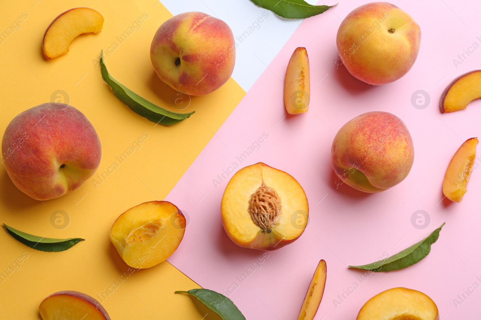 Photo of Flat lay composition with fresh peaches on color background