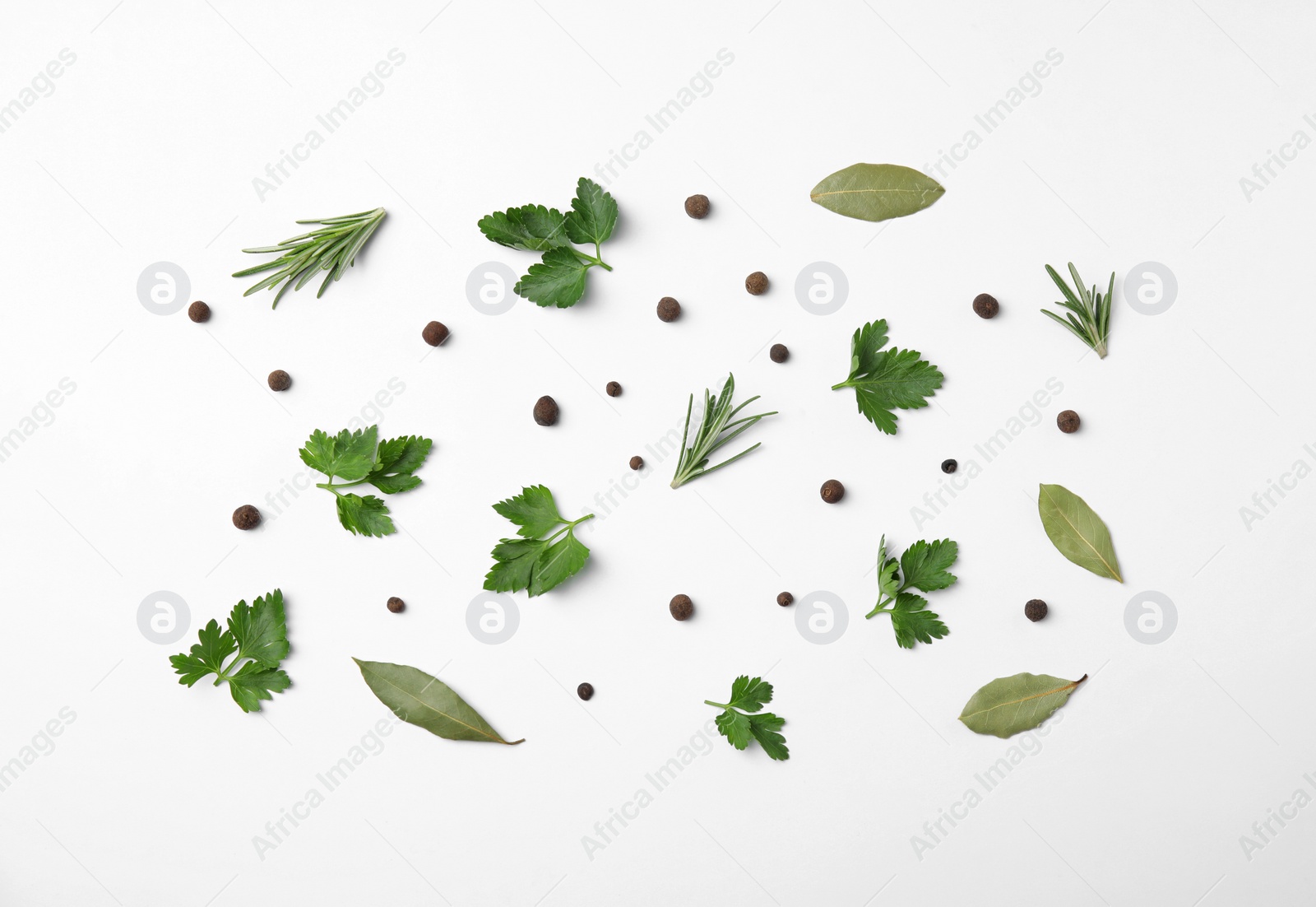 Photo of Flat lay composition with green parsley, pepper, bay leaves and rosemary on white background