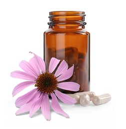 Bottle with vitamin pills and beautiful echinacea flower on white background