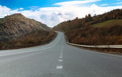 Empty asphalt road in mountains. Picturesque landscape