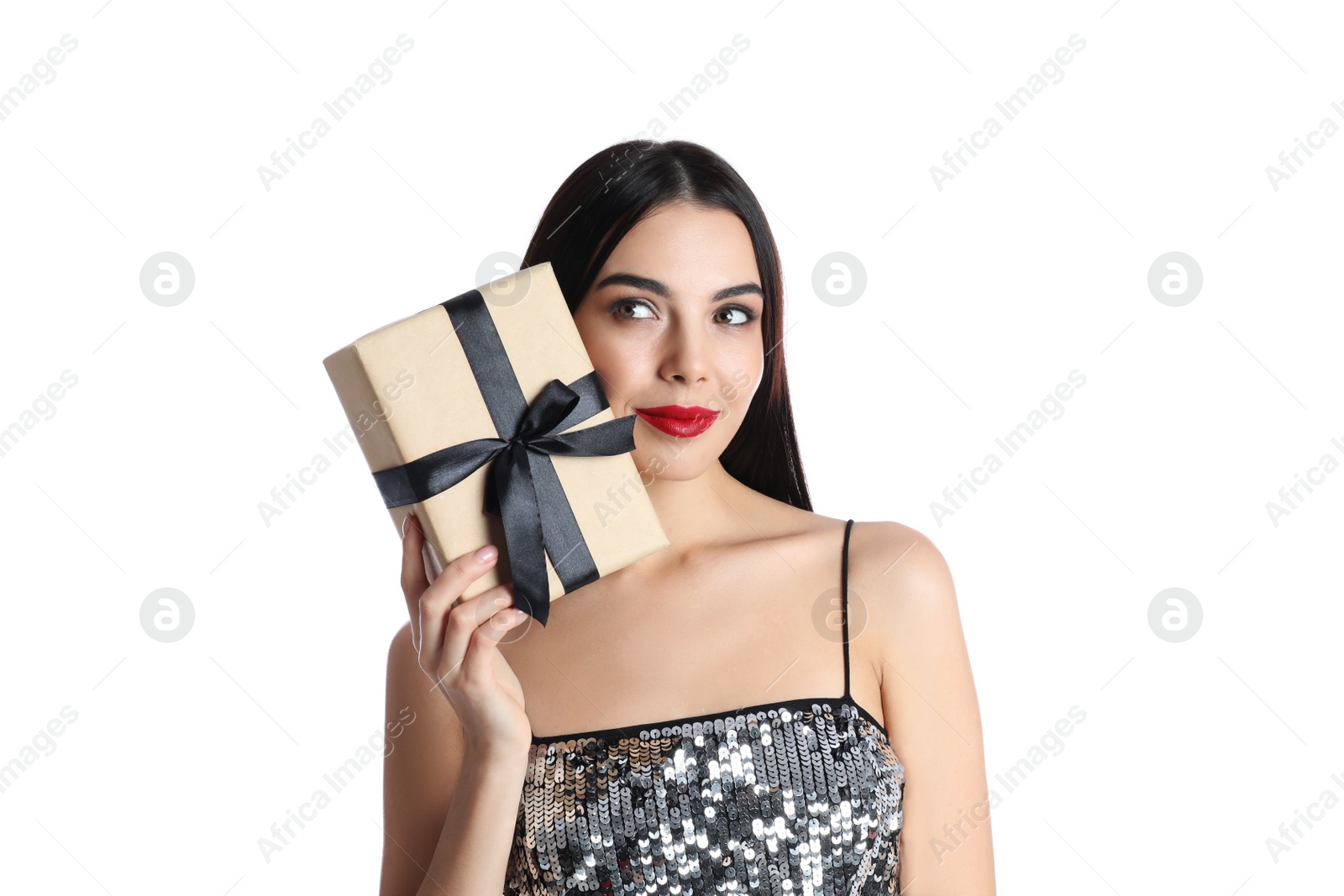 Photo of Woman in party dress holding Christmas gift on white background