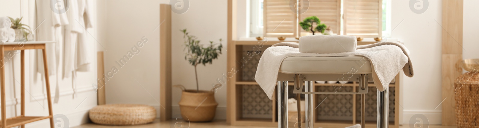 Image of Spa cabinet interior with massage table in wellness center. Banner design