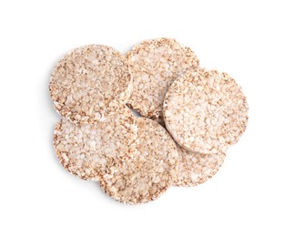 Many crunchy buckwheat cakes on white background, top view