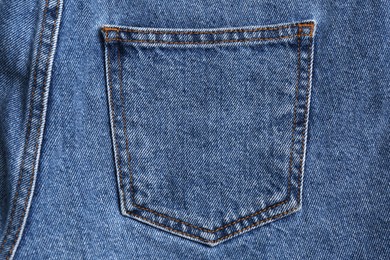 Photo of Light blue jeans with back pocket as background, closeup
