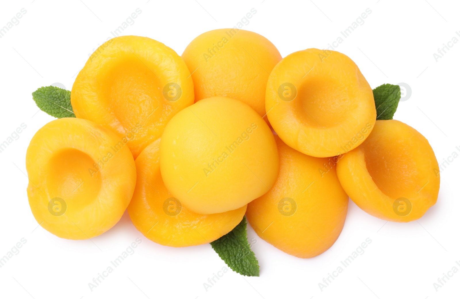 Photo of Sweet canned peach halves with mint isolated on white, top view