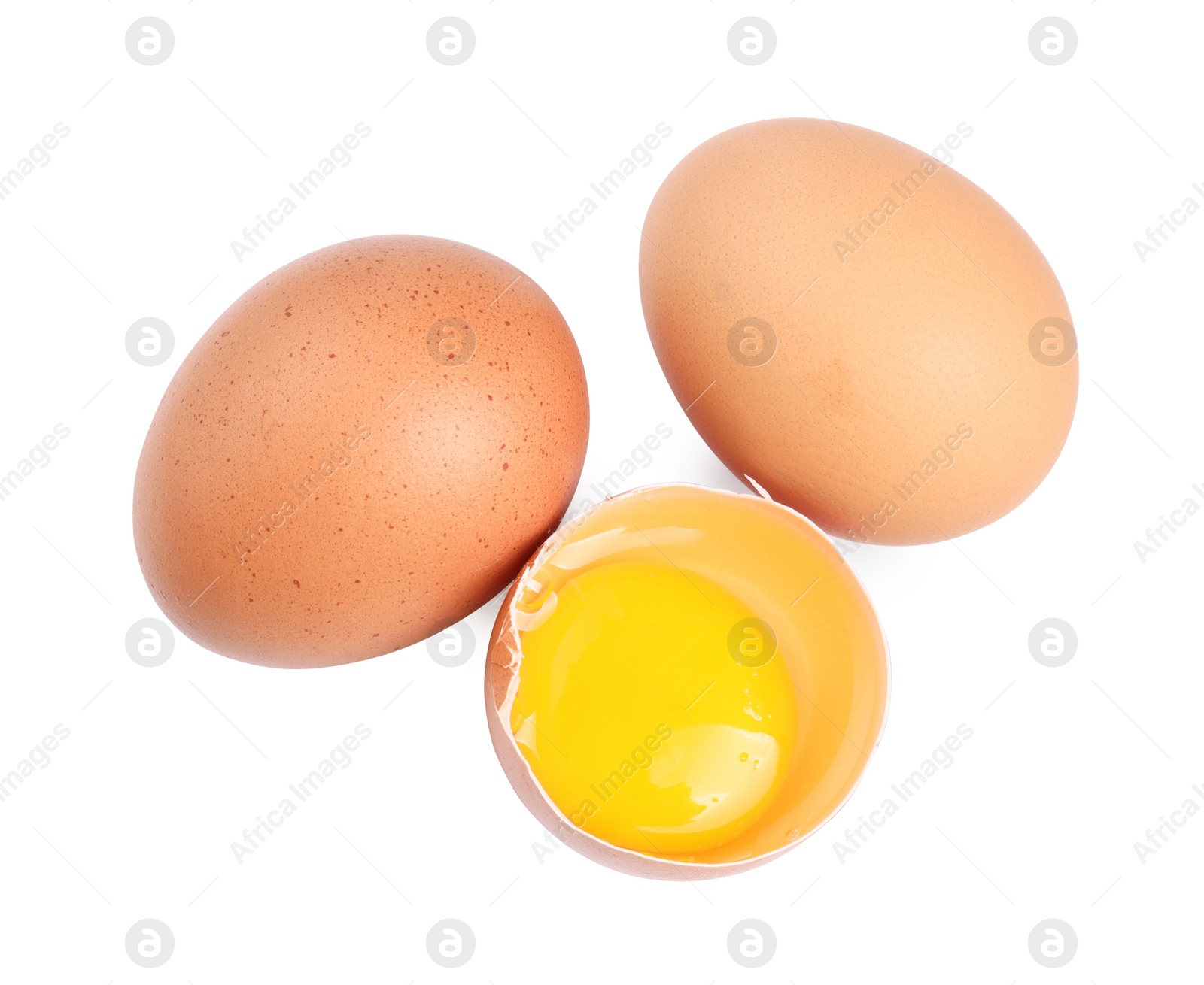 Photo of Whole and cracked chicken eggs isolated on white, top view