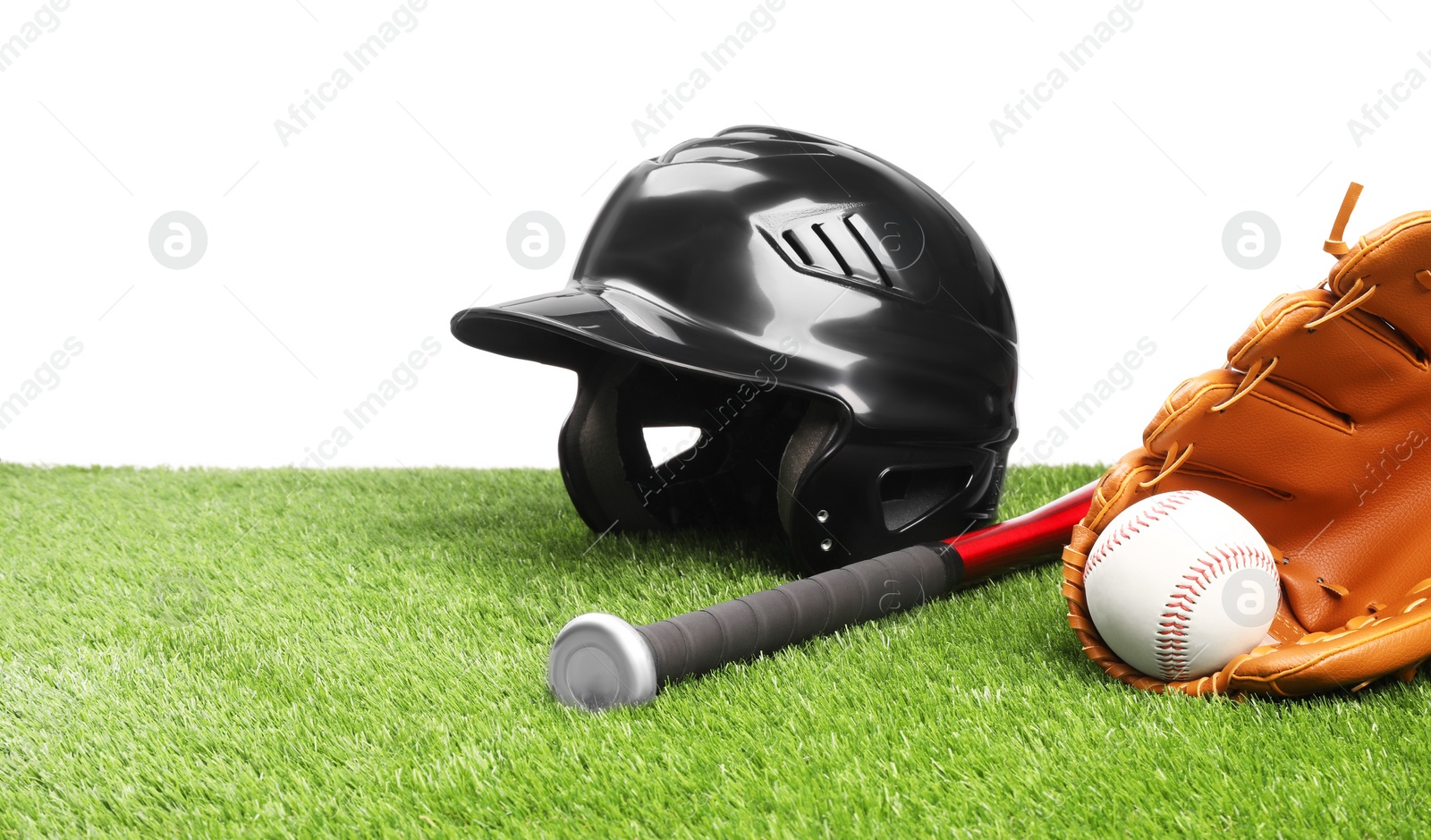 Photo of Baseball bat, ball, batting helmet and glove on artificial grass against white background, space for text