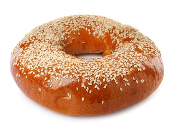 Photo of Delicious fresh bagel with sesame seeds isolated on white