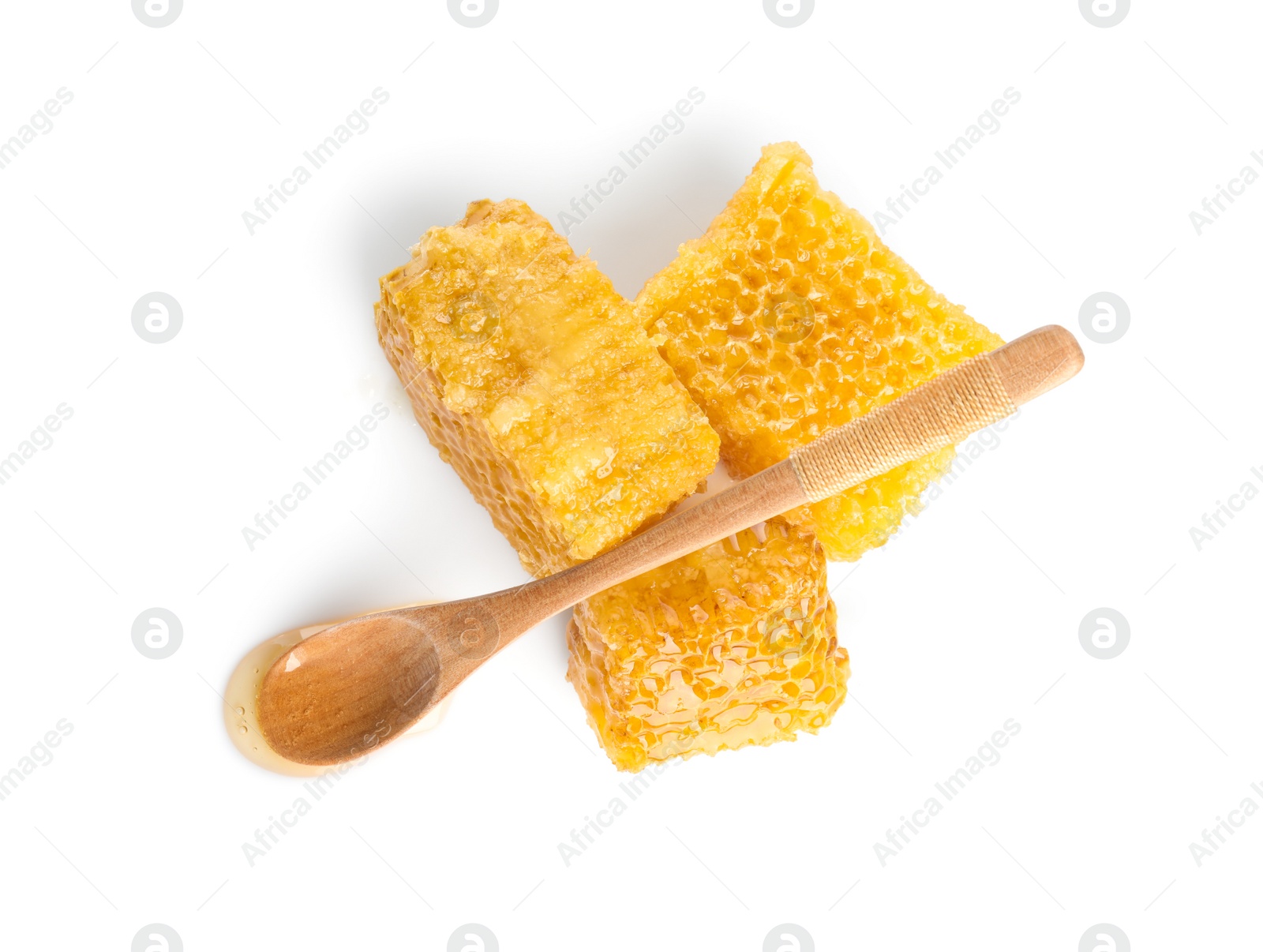 Photo of Fresh delicious honeycombs and spoon isolated on white, top view