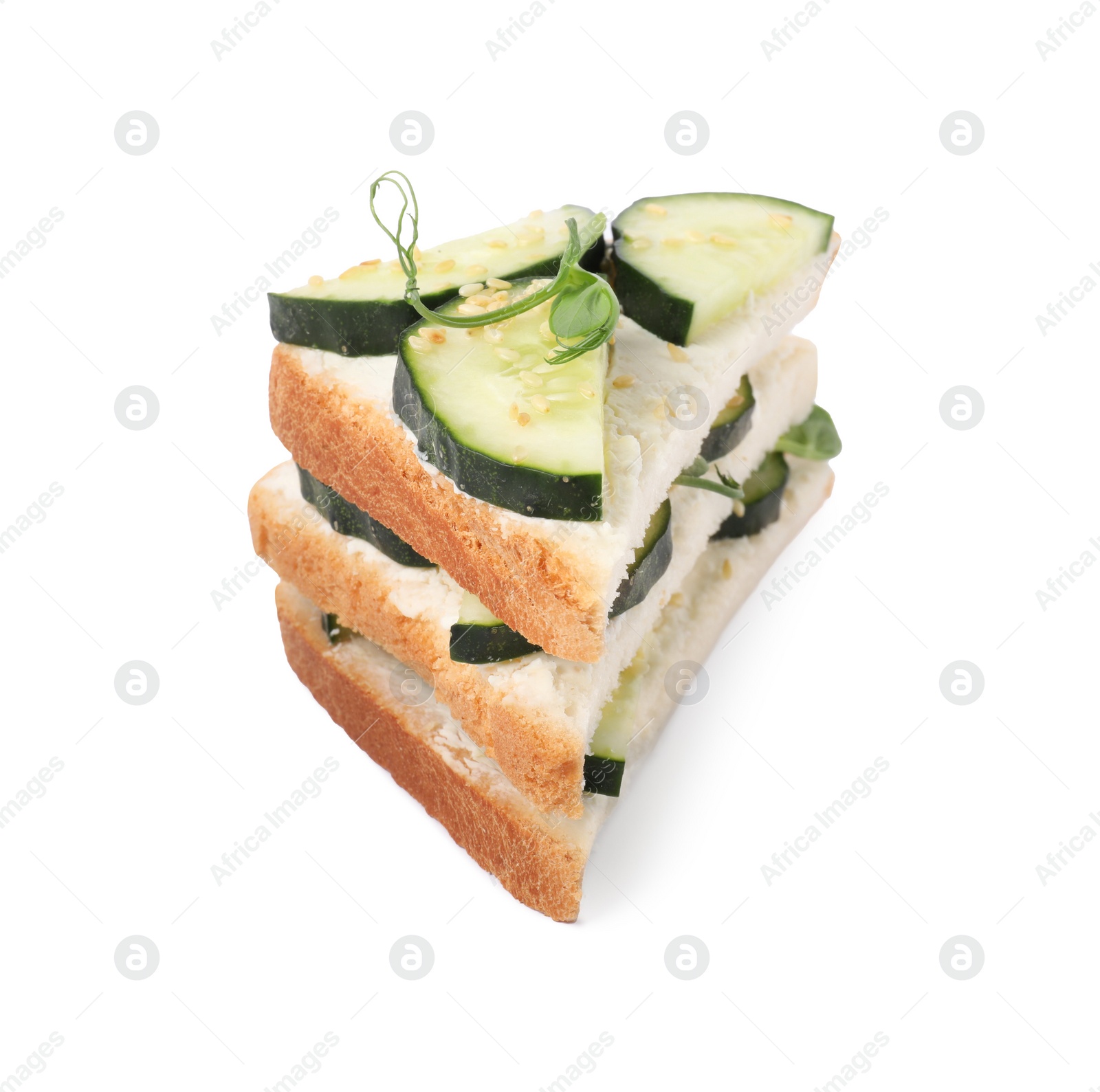 Photo of Tasty cucumber sandwiches with sesame seeds and pea microgreens isolated on white