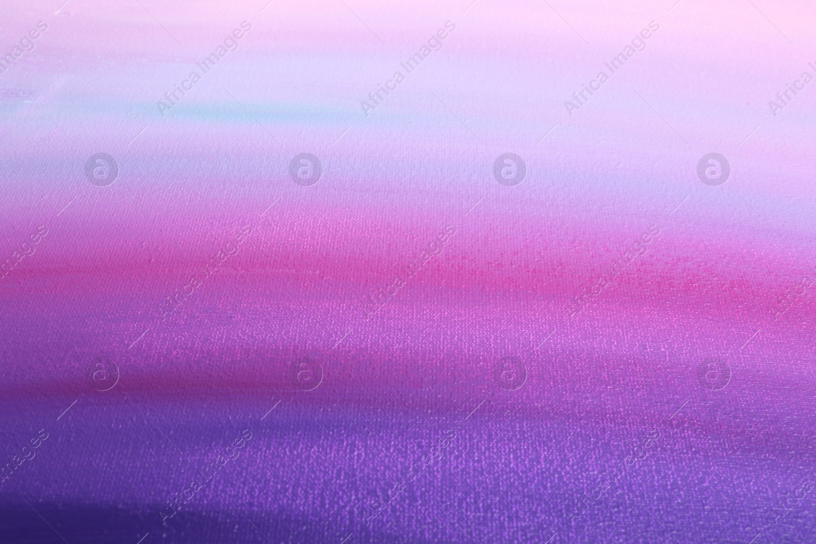 Photo of Canvas with colorful gradient painting, closeup view