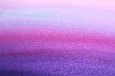 Photo of Canvas with colorful gradient painting, closeup view
