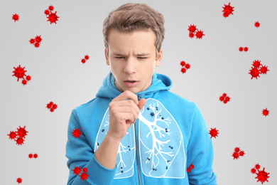 Teenage boy with diseased lungs surrounded by viruses on light background