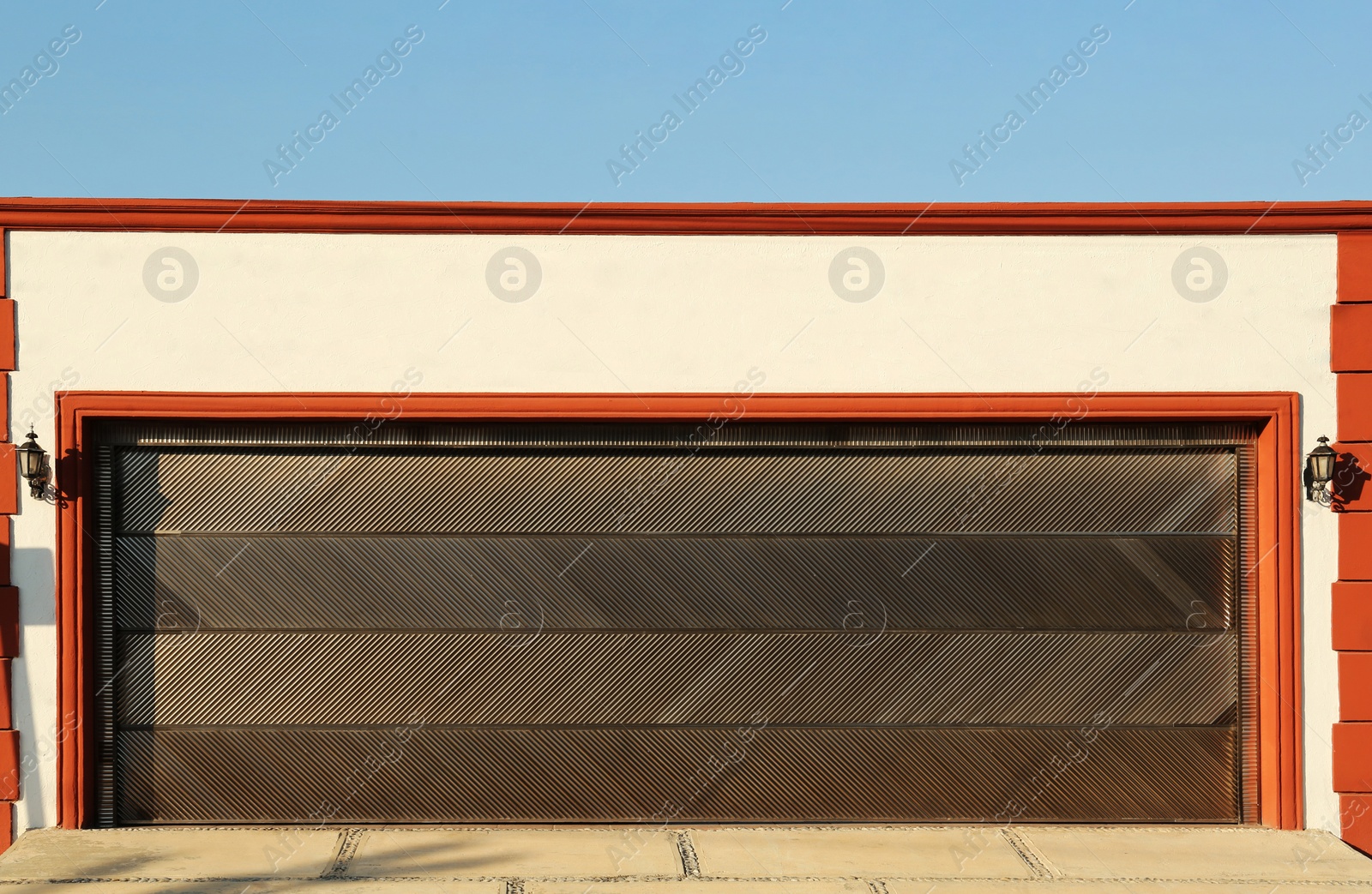 Photo of Garage building with closed sectional metal gate