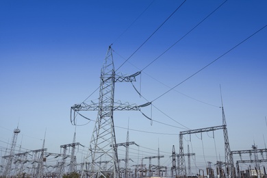 Photo of Modern electrical substation on sunny day, low angle view