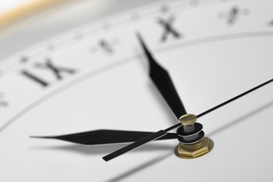 Photo of Closeup view of stylish clock. Interior element