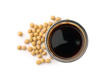 Photo of Bowl of soy sauce and soybeans isolated on white, top view