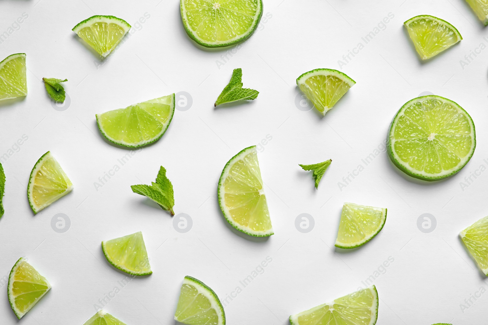 Photo of Composition with fresh ripe limes on white background, top view