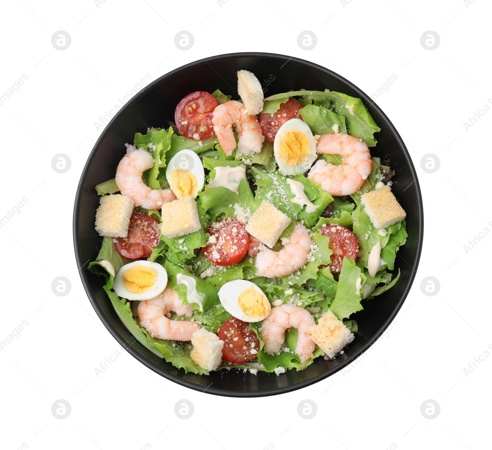 Photo of Delicious Caesar salad with shrimps isolated on white, top view