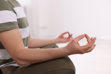 Photo of Closeup viewman meditating on blurred background