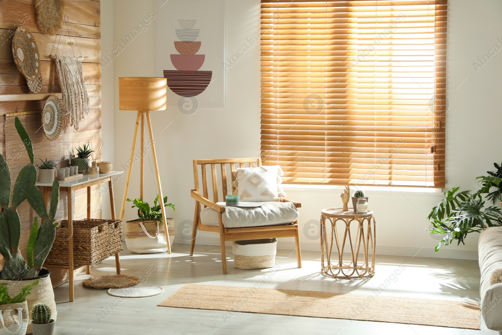 Photo of Stylish living room interior with comfortable wooden armchair and beautiful houseplants