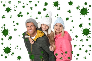 Stronger immunity - better disease resistance. Happy family with daughter in warm clothes surrounded by viruses on white background