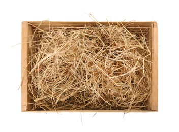 Dried hay in wooden crate on white background, top view