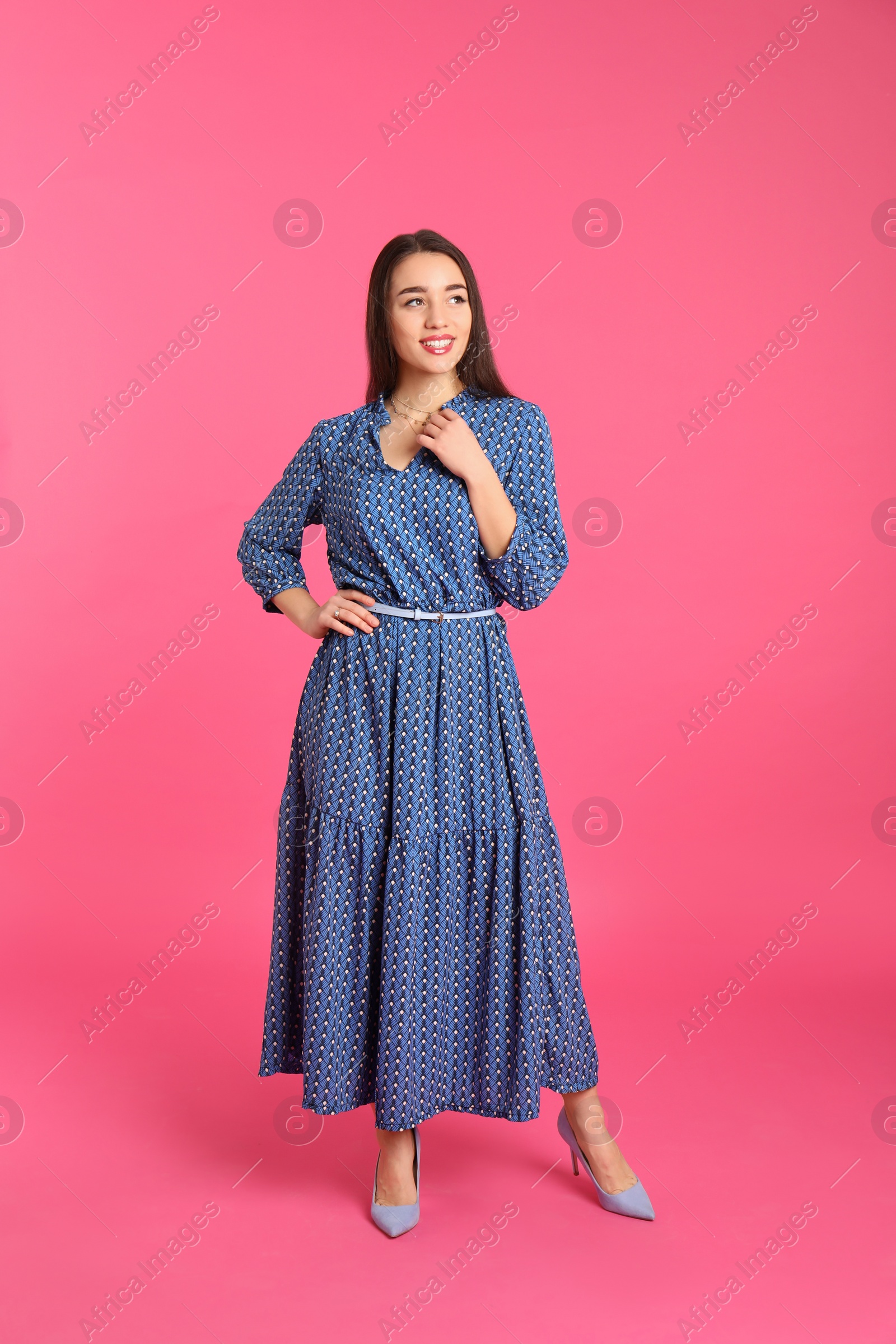 Photo of Portrait of beautiful young woman in stylish dress on color background